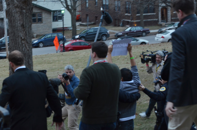 photo 2 of dream action protesters being escorted out of the iowa freedom summit