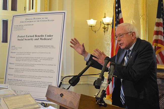 photo 2 of Sen. Bernie Sanders receiving petitions on Social Security